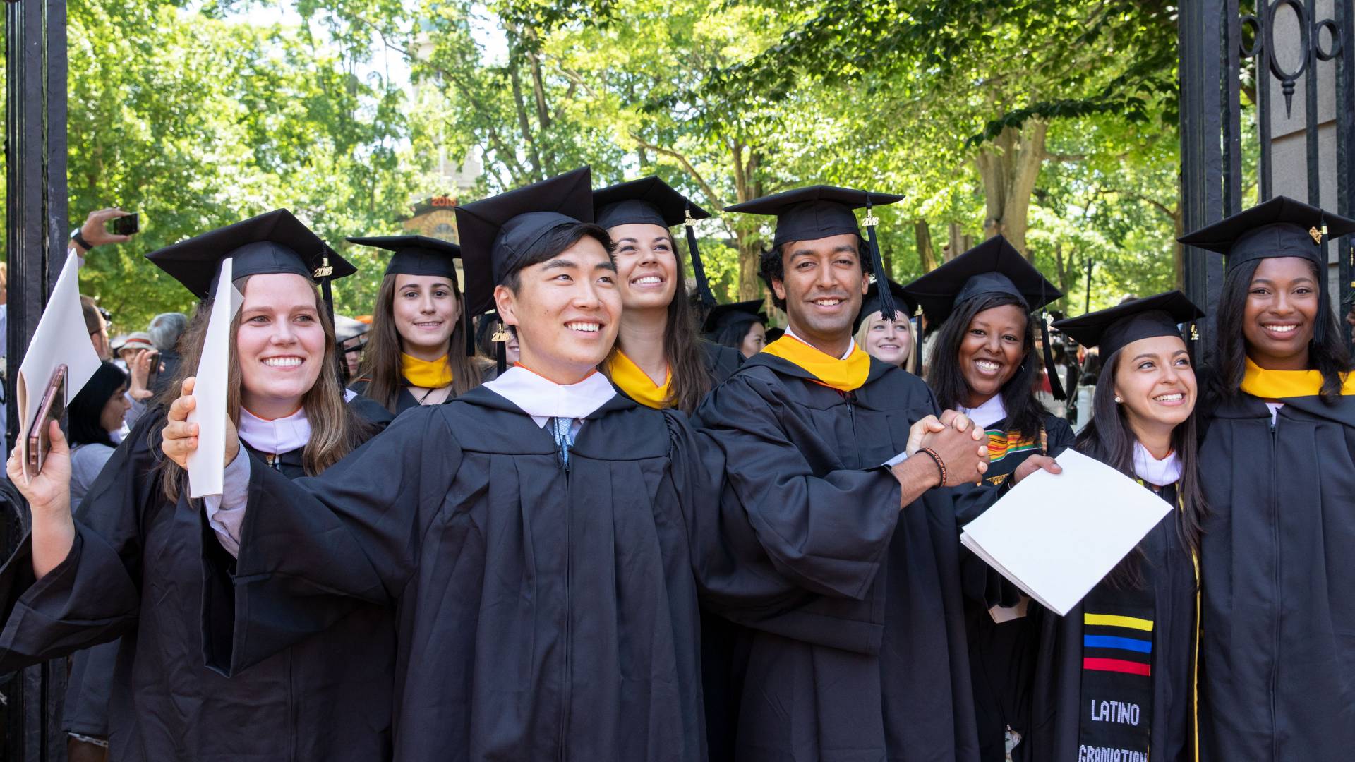 Students coming through FitzRandolph Gate after Commencement ceremony