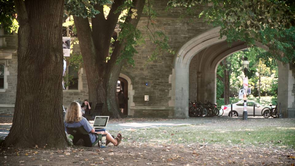 Students hanging out on campus by Rocky Mathey dorms