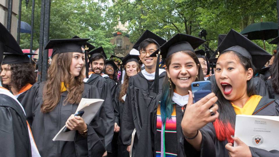 Graduating students stream out of Fitzrandolph Gates