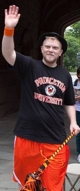 Alumnus waving