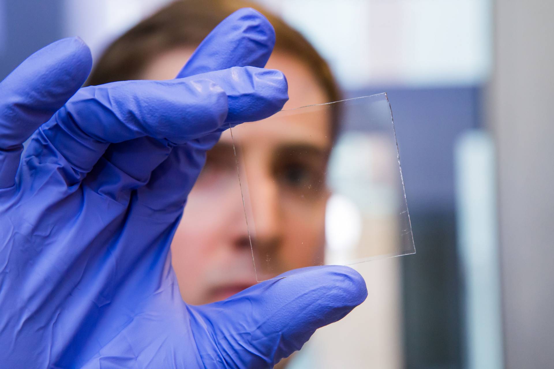 Nicholas Davy holds a sample of the special window glass