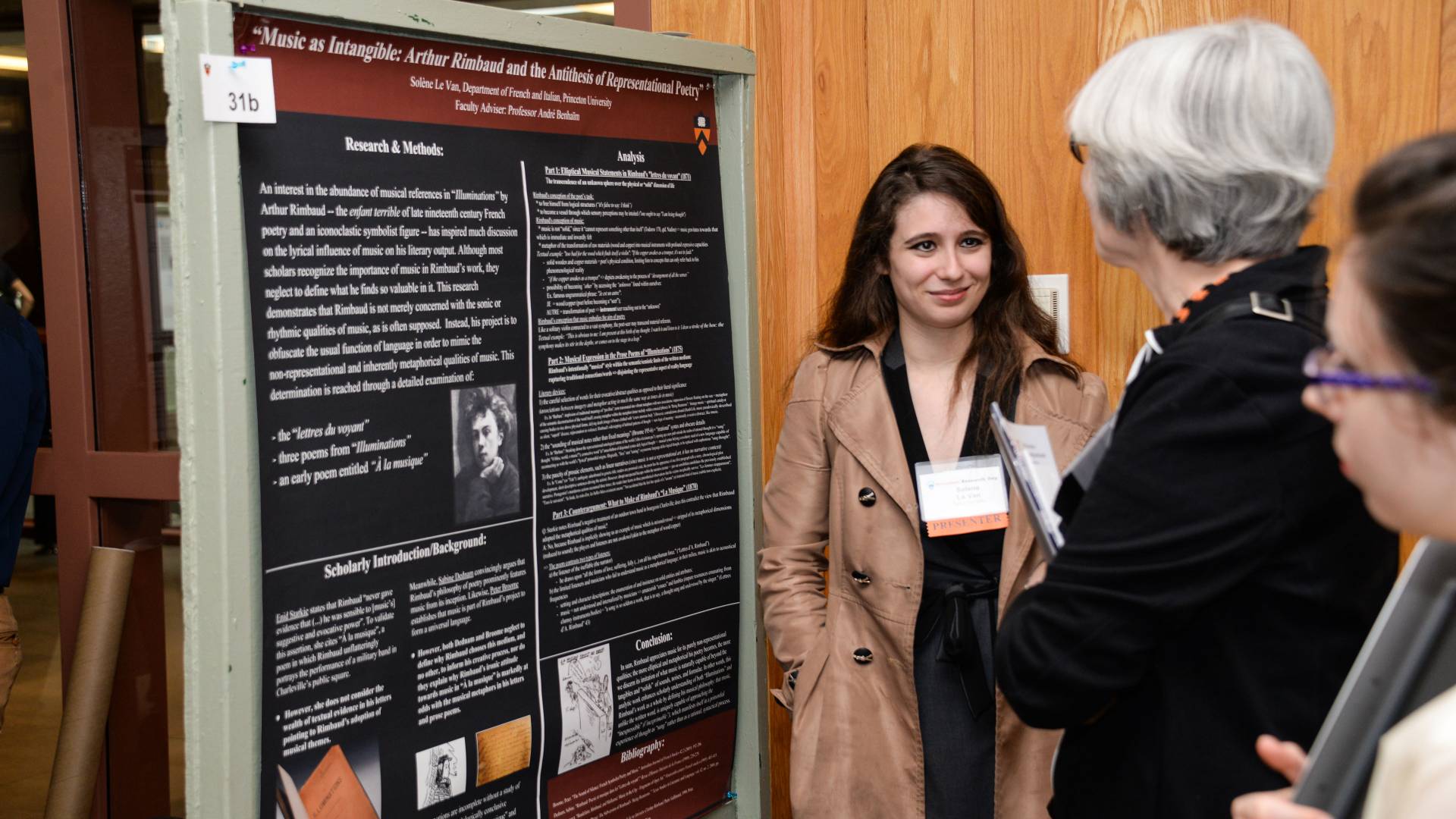 Solene Le Van discussing her poster with judges