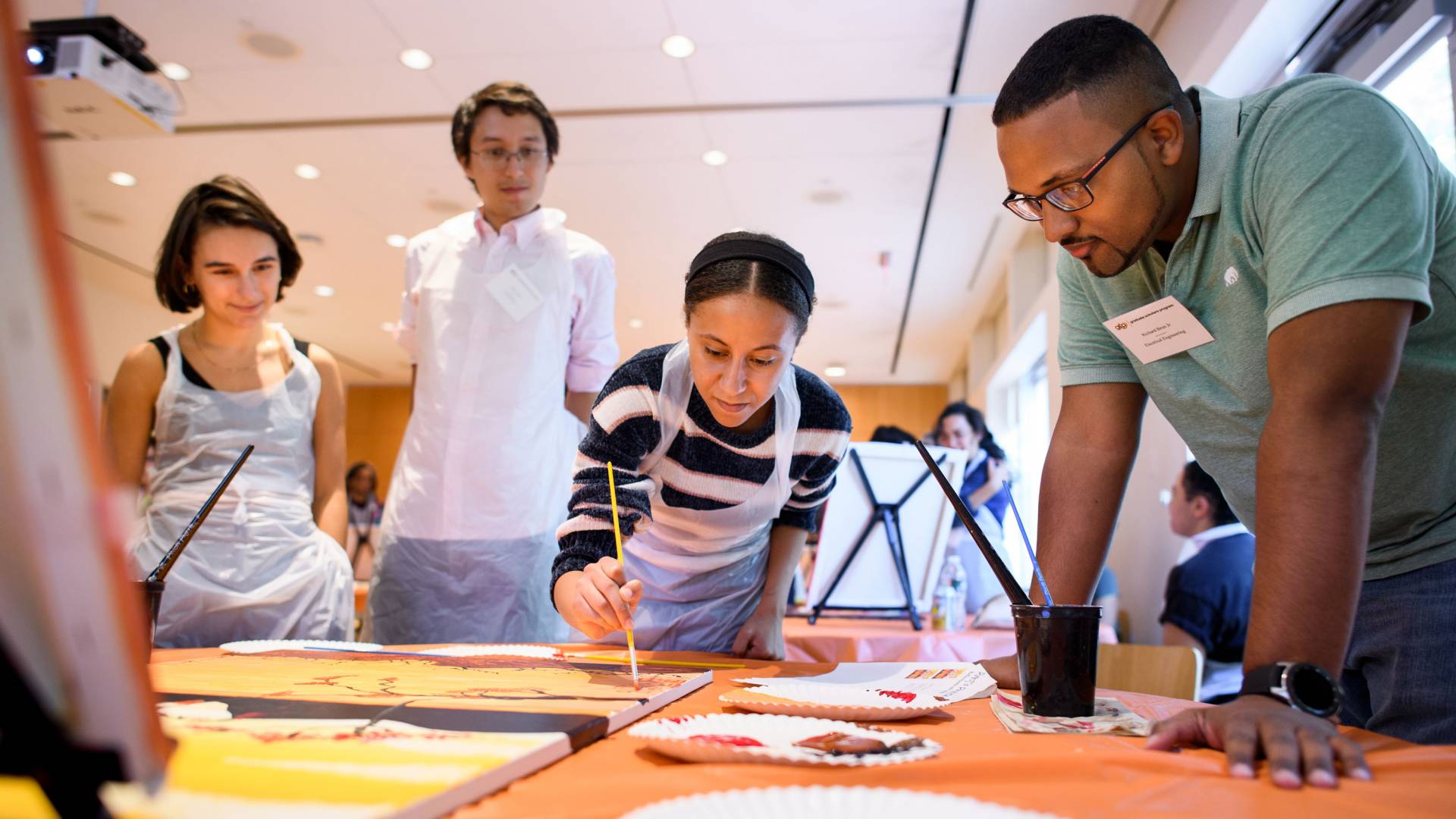 Graduate dtudents painting