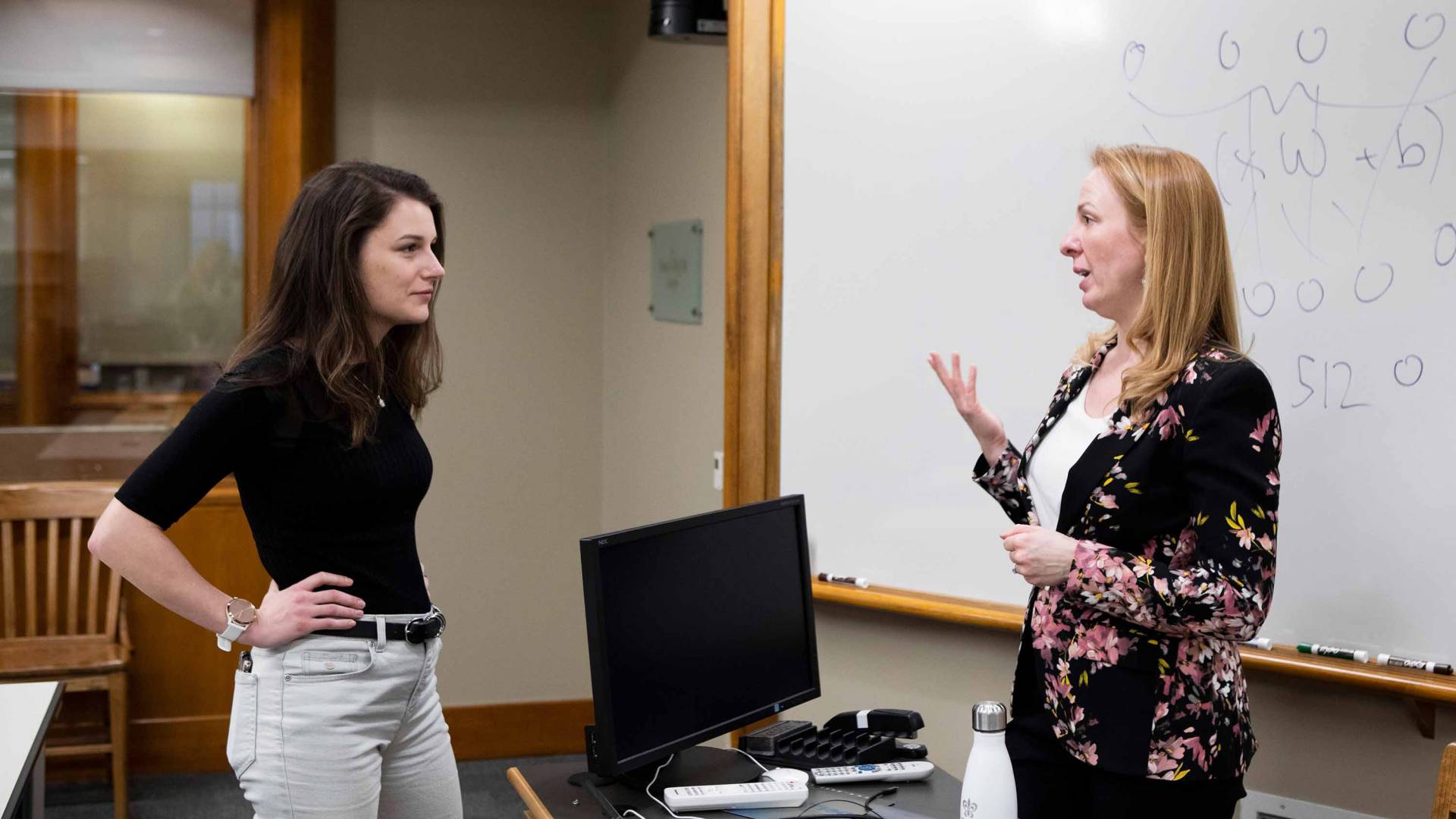 Prof. Leslie talking with a student