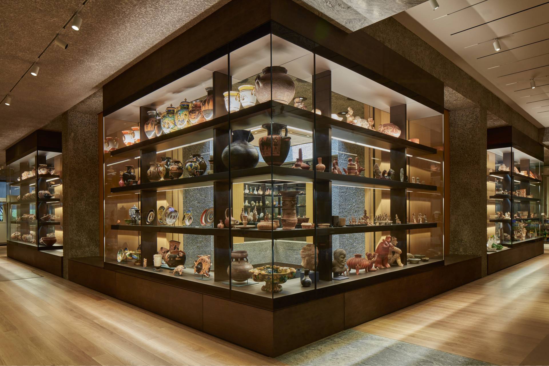 Beautifully intact rows of ancient pottery arranged on shelves in the new Princeton University Art Museum